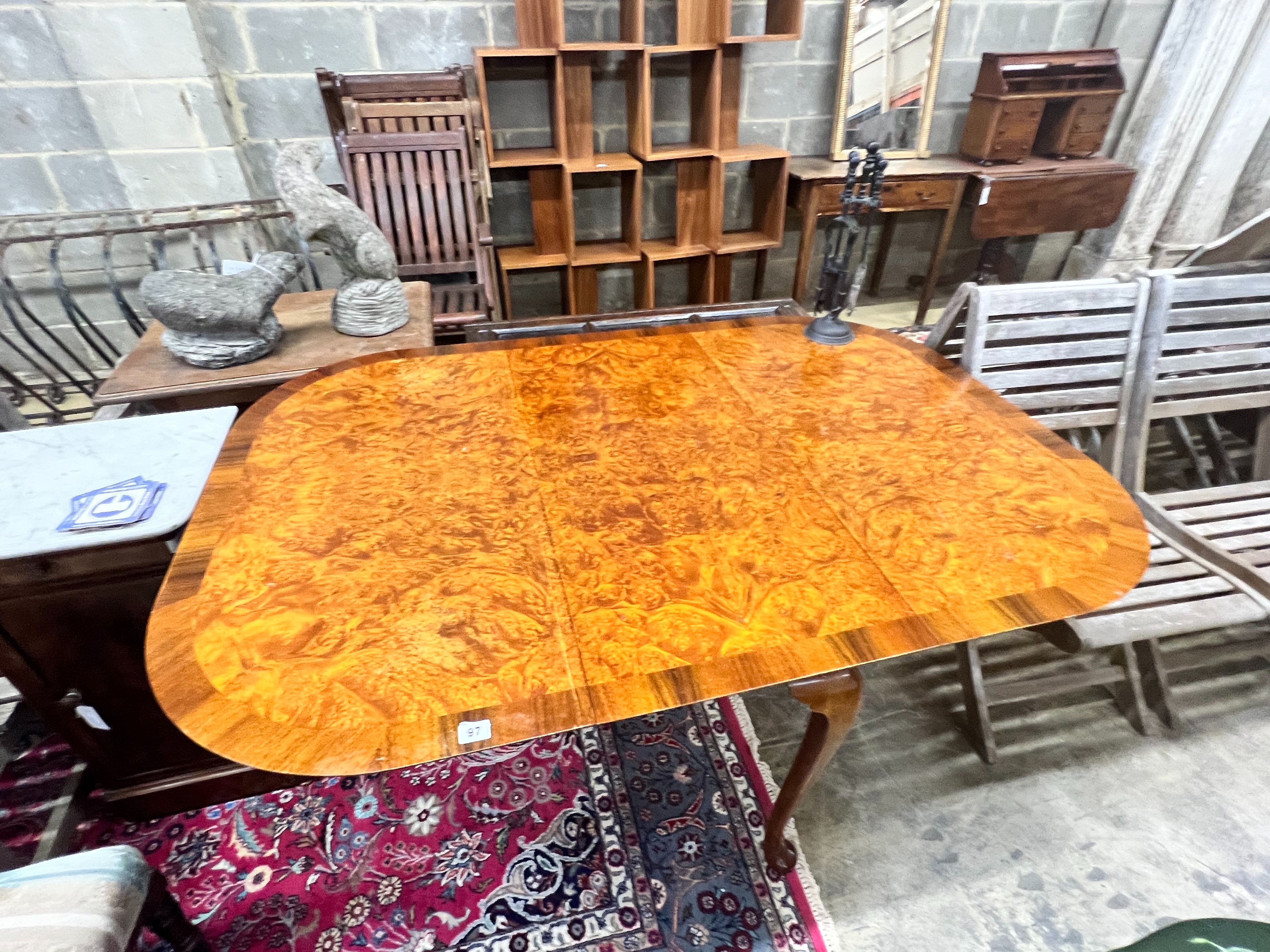 A Queen Anne Walnut revival burr walnut pad foot drop leaf dining table, extended 144cm wdith 99cm height 74cm